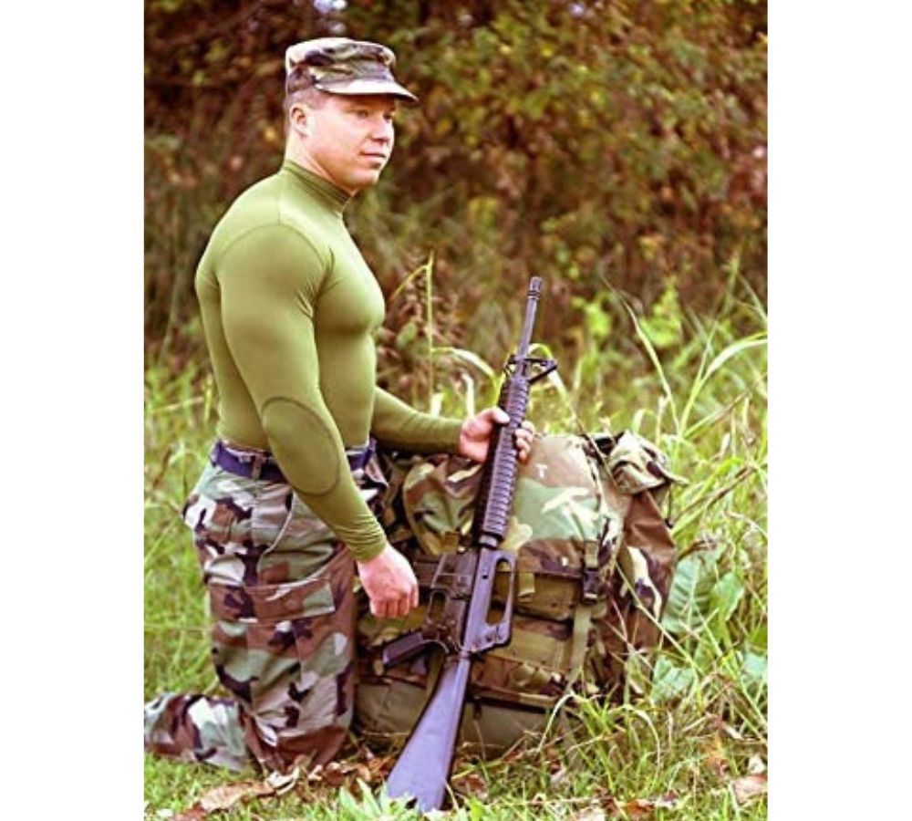 A picture of person in the army who is wearing the green shirt.